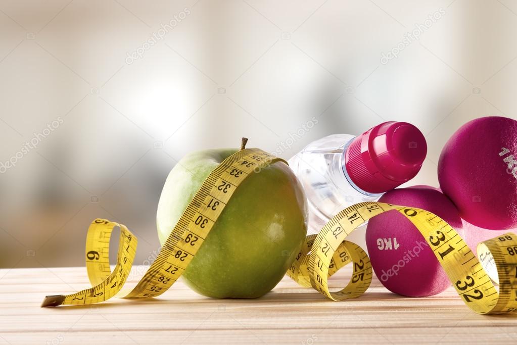 Yellow Tape Measure And A Water Bottle Stock Photo - Download