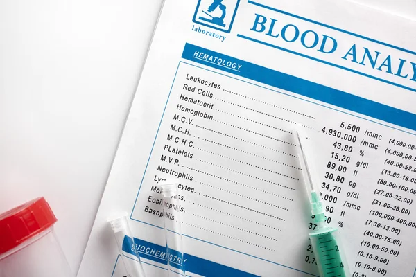 Blood test report with vials urine container and syringe top — Stock Photo, Image