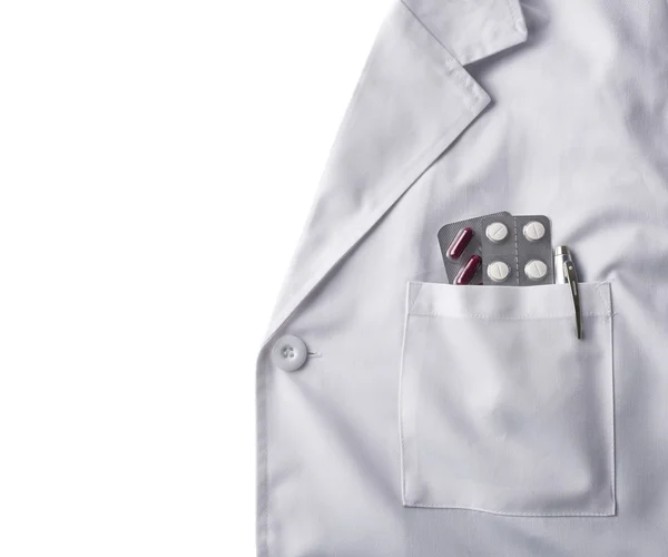 Klänning vit läkare med piller bakgrund — Stockfoto