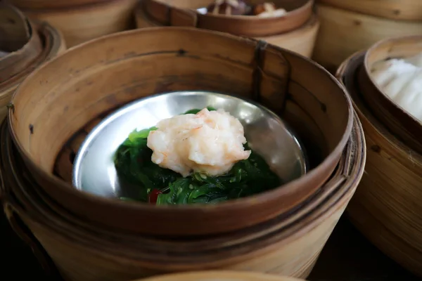 steamed shrimp balls with seaweed, Chinese steamed dumpling or dim sum in basket