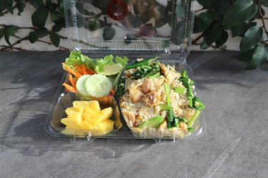 stir fried rice with vegetable and pineapple in the box