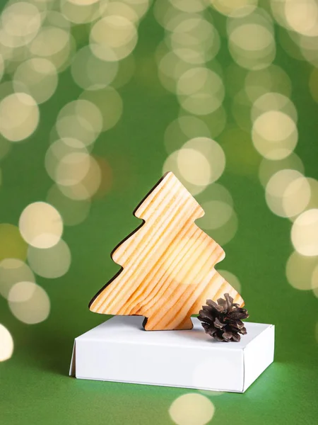 The new year concept as a wooden conifer tree with the golden lights. — Stock Photo, Image