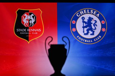 NYON, SWISS, NOVEMBER 2. 2020: Stade Rennes vs. Chelsea. Football UEFA Champions League 2021 Group Stage match. UCL Trophy silhouette, sign of club on the screen in background clipart