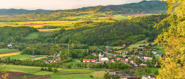 The village of Zelazno in a mountain valley, view from the top of the Wapniarka mountain before sunset.