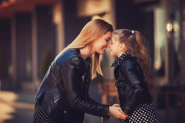 young beautiful woman with her little cute daughter