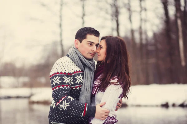 loving couple standing arm in arm