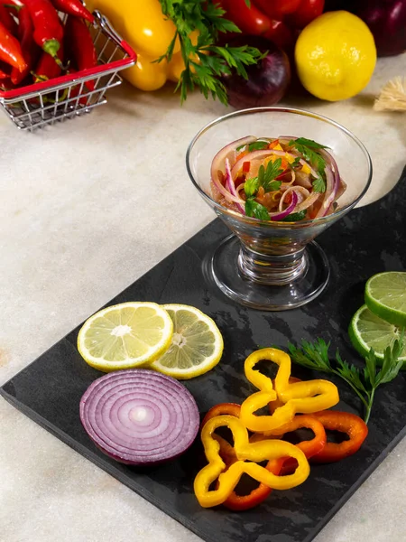 Peruvian ceviche is a traditional dish consumed in Peru. The preparation method is different from other places, using lemon, fish, potatoes, onion, seaweed, corn, chili, ginger, milk, sweet potato.