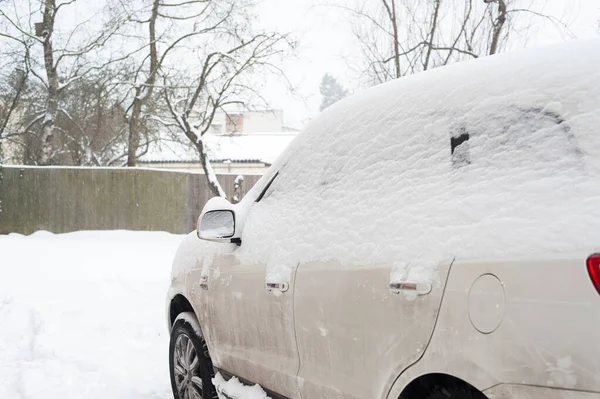 White dirty car snow capped. Outside horizontal winter time image