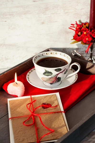 Valentine love greeting card and coffee cup on wooden tray — Stock Photo, Image