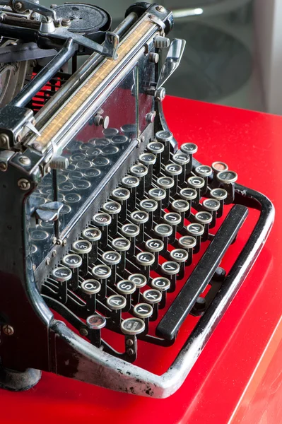 Old retro black metallic typewriter with antique round  keys. — Stock Photo, Image