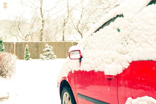 Red car and mirror snow capped. Winter-time outside. Outdoors. — Stock Photo, Image