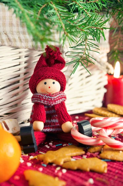 Decorative wooden doll on christmas background. Close-up. — Stock Photo, Image