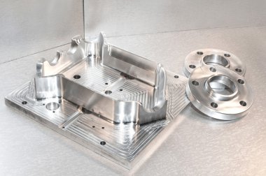 Metal mold and steel flanges. Milling industry. cnc technology. clipart