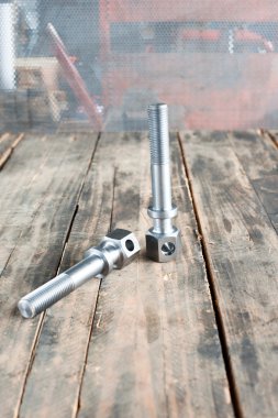 Semi-finished iron die- bolts nuts and cylinders. Metal engineer