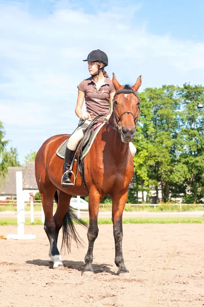 Teenage girl equestrian riding thoroughbred horseback. Vibrant s — Stock Photo, Image