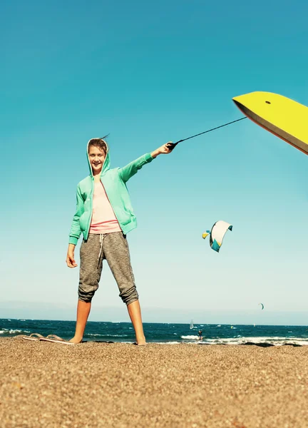 Fun on summer beach. Happy cheerful teenage girl with surfboard — Zdjęcie stockowe