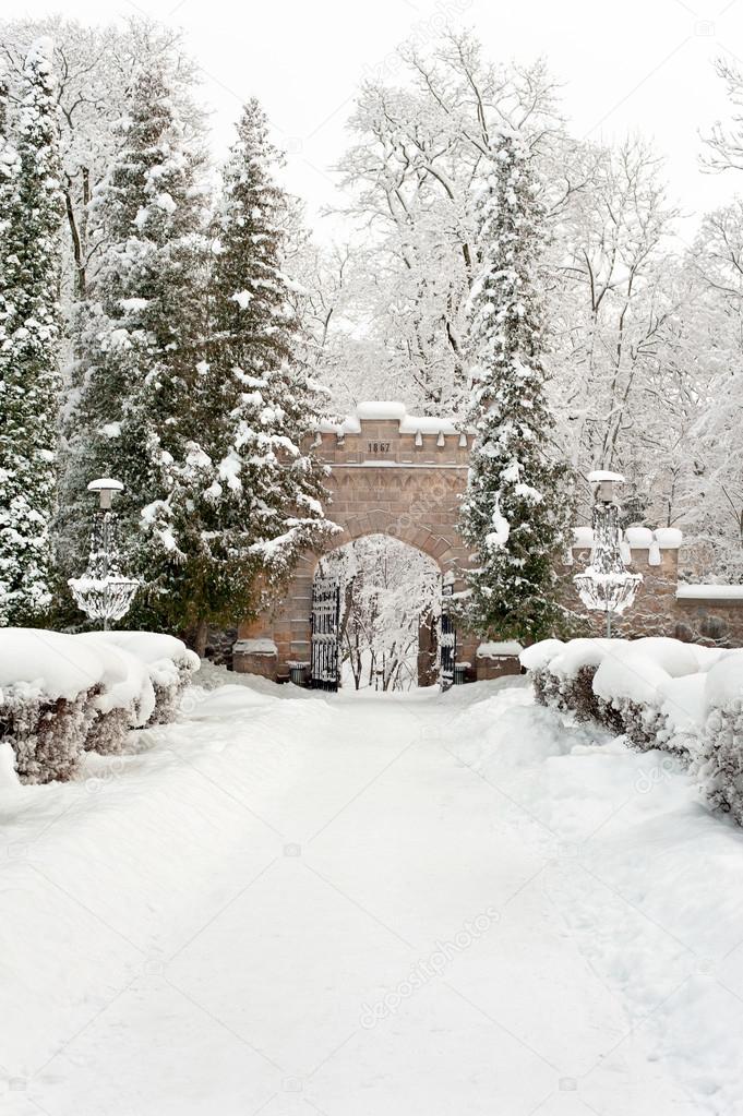 Gates of royal palace in Sigulda covered with winter snow