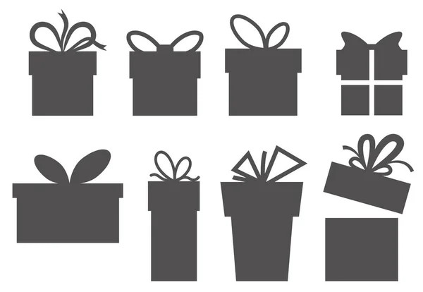 A set of simple gift boxes. Silhouettes of the boxes. Vector — Stock Vector