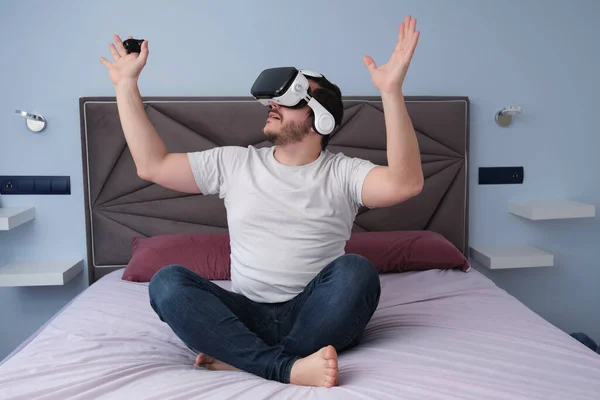 Young Man Using Virtual Reality Headset Bed Having Fun Home — Zdjęcie stockowe