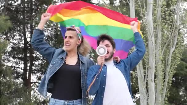 Two Friends Smiling Shouting Megaphone Gender Equality Rainbow Flag Lgbt — Stock Video