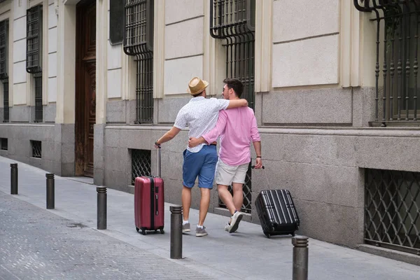 Gay Tourist Couple Carrying Suitcases Going Hotel Embraced City Street — Stock Photo, Image