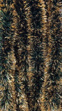 Altın ve koyu yeşil çizgili çelenk arkaplanının soyut dokusu Noel tatili için