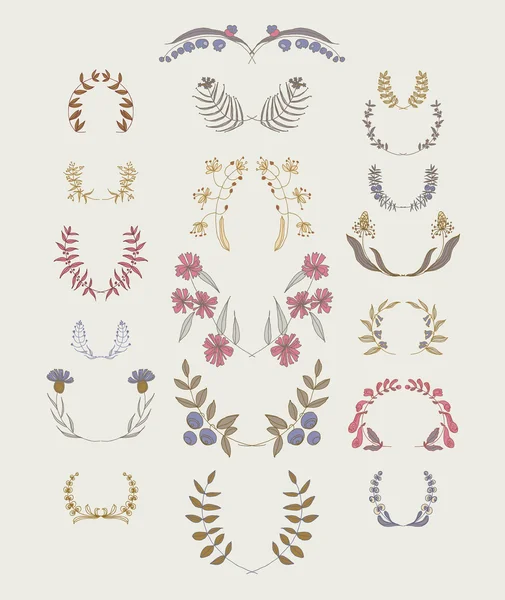 Set of symmetrical floral graphic design elements. — Stock Vector