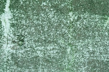 Yeşil boya kalıntılarıyla beton bir duvar. Arka plan.