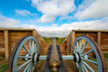 A Revoluationay War Era Cannon Looking Out From General Muhlenberg's Brigade Redoubt in Valley Forge National Historical Park clipart