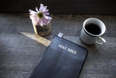 Morning Coffee With Bible Illuminated By Sunlight clipart