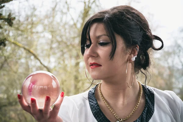 Mulher com bola de vidro — Fotografia de Stock