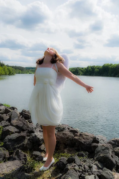 Angel woman with water and sky — Stock Photo, Image