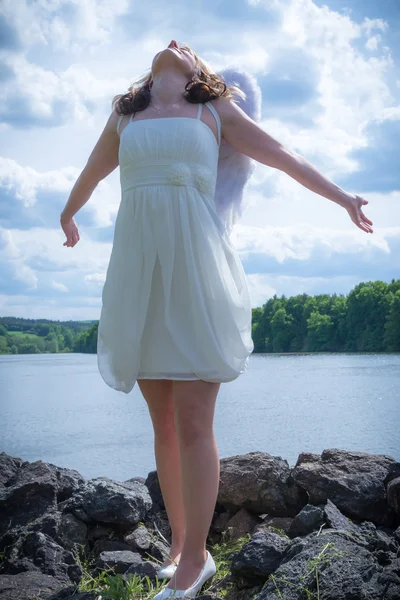 Angel woman with water and sky — Stock Photo, Image