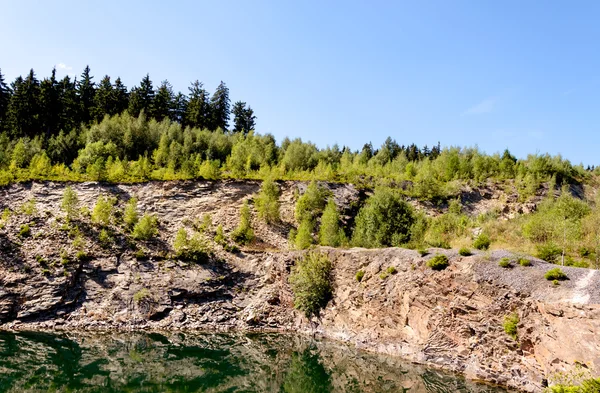 Quarry with lake — Stockfoto