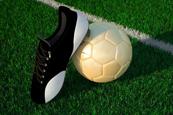 Bola de fútbol en el campo y zapato de fútbol — Foto de Stock
