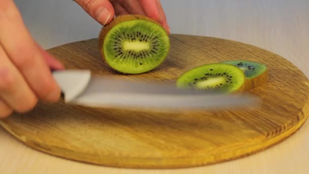 Women Cuts Knife Half Unpeeled Kiwi Wooden Board Juicy Vitamin — Stock Video