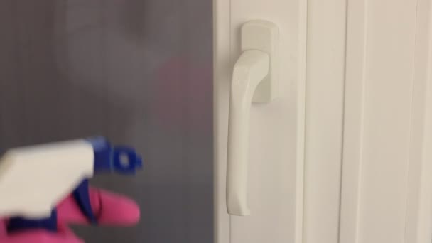 Woman Rubber Gloves Spray Antibacterial Disinfectant Cleans Balcony Door Handle — Stock Video