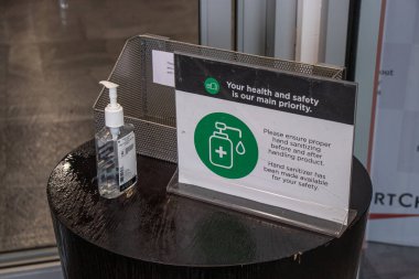 Courtenay, Vancouver Island, Canada - November 21,2020: View of hand sanitizer at the entrance of SportChek Store due to COVID-19 Prevention clipart