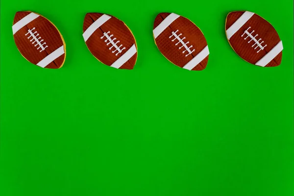 American Football Balls Isolated Green Background Top View — Stock Photo, Image