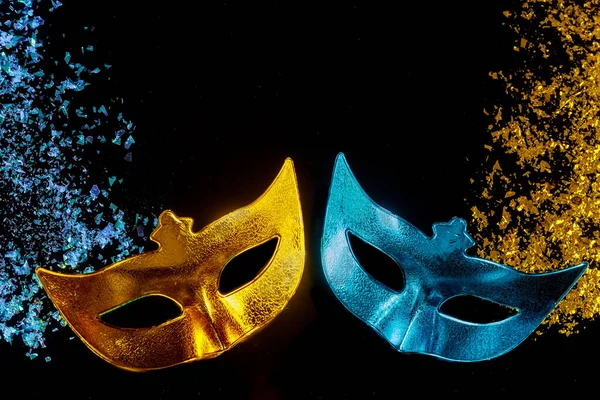 Carnival masks on black background. Jewish holiday Purim.