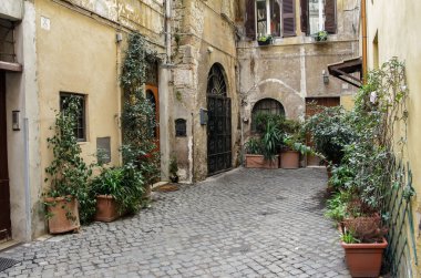 ROME, ITALY - FEBRUARY 22, 2015: Charming old and small street clipart