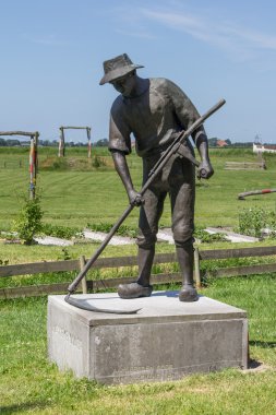 Allingawier, Hollanda, 27 Haziran 2015 bir biçme heykeli