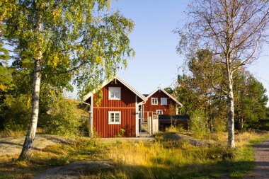 Red cottages on the island Harstena in Sweden, principally known