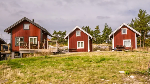 Traditional red wooden holiday homes in Sweden Europe — Stock Photo, Image