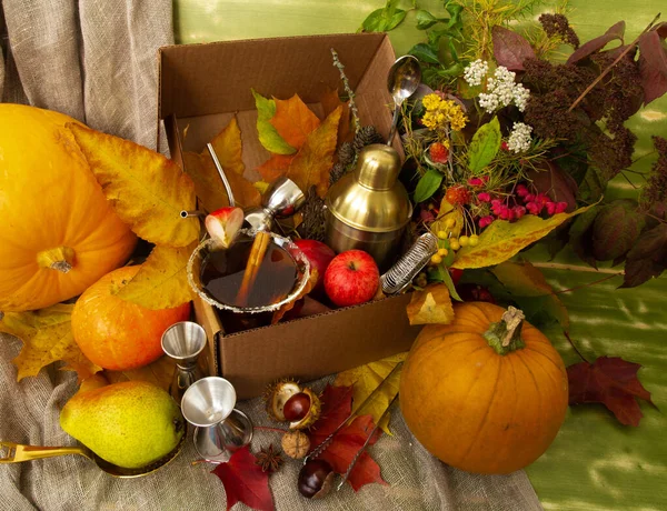 Fall Halloween Thanksgiving season special post delivery box with fruits and vegetables apples pumpkin maple leaves bar accessories including shaker martini cocktail. Bar autumn specialties promo — Stock Photo, Image
