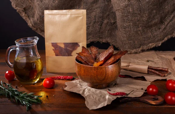 Jerky Snacks Wooden Bowl Olive Oil Glass Jug Meat Sticks Royalty Free Stock Photos