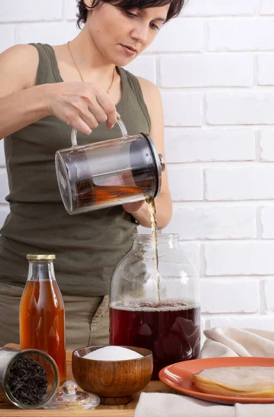 Girl Pouring Brew Sweetened Black Tea Sterilised Glass Jar Ready — Stock Photo, Image