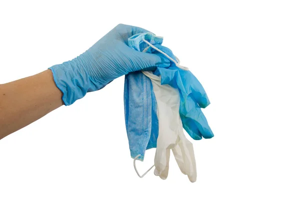 Hand Een Blauwe Medische Handschoen Houdt Een Gebruikt Masker Handschoenen — Stockfoto