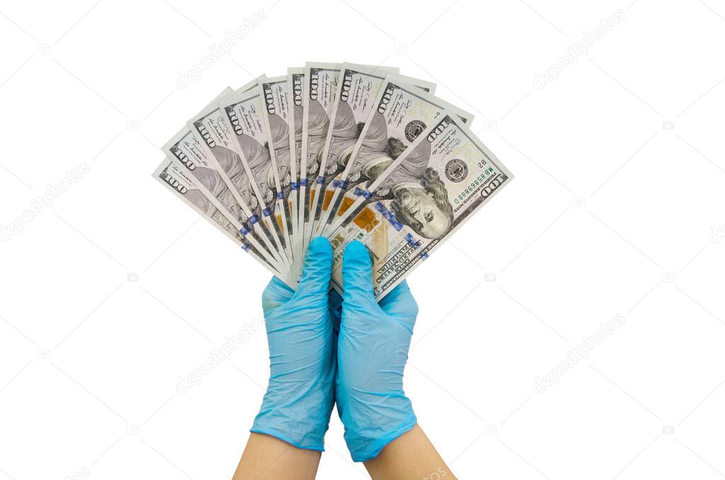 hands in blue medical gloves hold dollars isolated on white background.