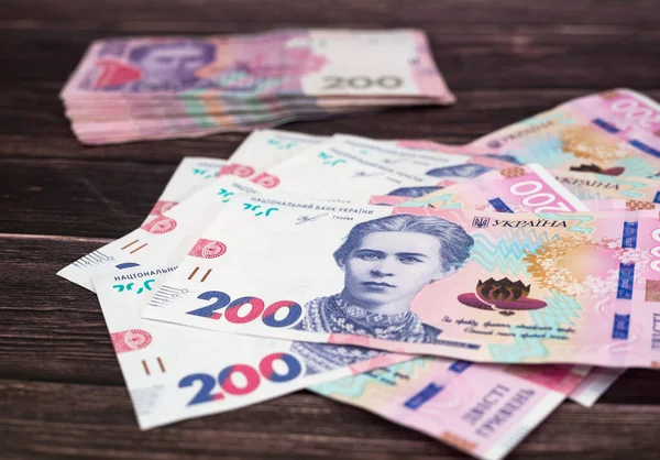 Ukrainska Pengar Trä Bakgrund Nya Och Gamla Sedlar Med 200 — Stockfoto